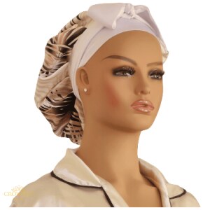 Get the perfect look with our collection of stylish and comfortable satin bonnets. Our bonnets are designed to keep your hair looking beautiful and healthy while giving you the perfect crowning touch. Our collection is pre-made and perfect for all hair types. Show off your unique style with a beautiful satin bonnet from Crowned by Her. 