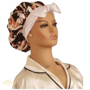 Get the perfect look with our collection of stylish and comfortable satin bonnets. Our bonnets are designed to keep your hair looking beautiful and healthy while giving you the perfect crowning touch. Our collection is pre-made and perfect for all hair types. Show off your unique style with a beautiful satin bonnet from Crowned by Her. 